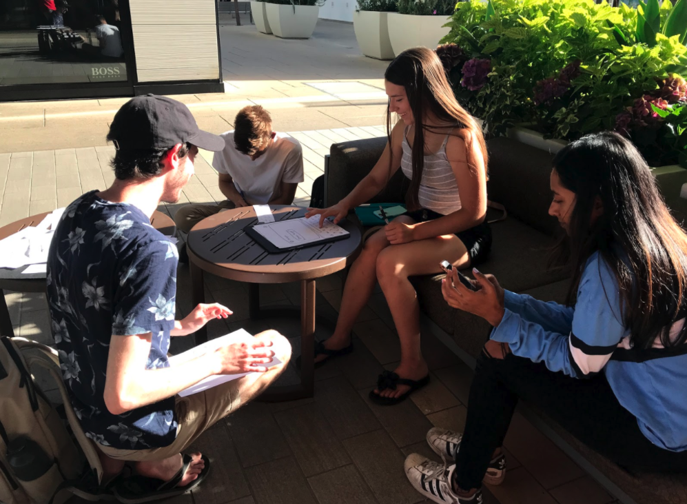 Image of students testing a paper prototype